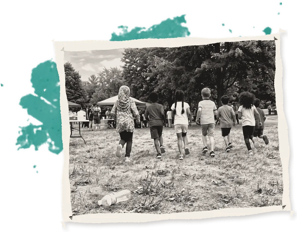 Children running across a summer field towards the tents