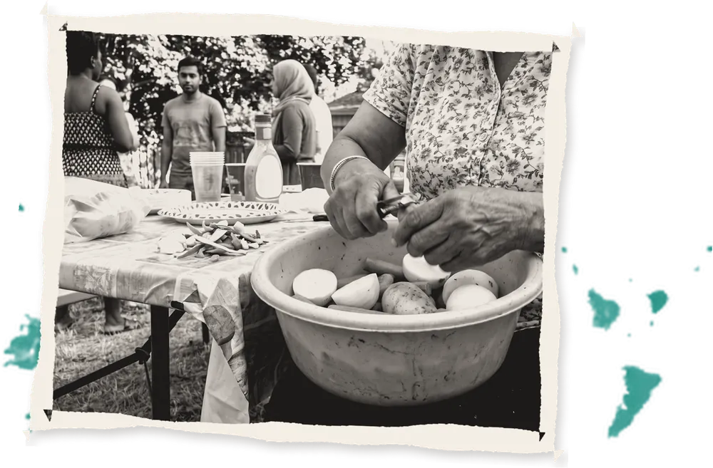 Hands peeling vegetables into a bowl
